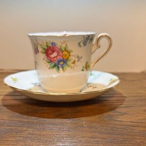 Tuscan Bone China Teacup and Saucer with floral frog to arrange flowers.